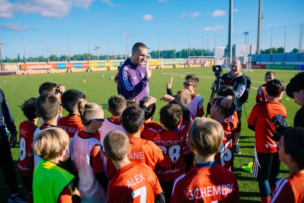 Nemanja Vidić Guides Local Youth Footballers During a Football Session